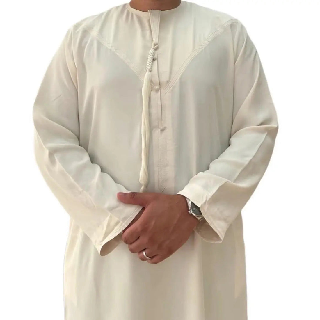 Cream Omani Zibda Thobe, front view showing the tassel and tonal stitching.