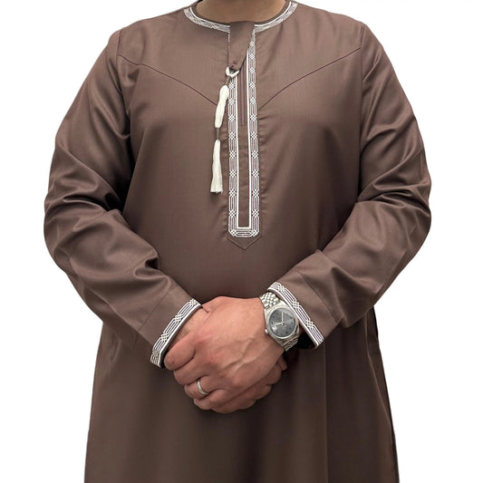 Brown Embroidered Omani Thobe, front view showing pale embroidery and tassel.