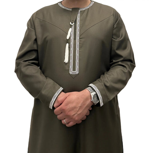 Green Embroidered Omani Thobe, front view showing pale embroidery and tassel.