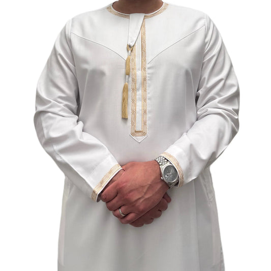 White Embroidered Omani Thobe, front view showing gold-tone embroidery and tassel.