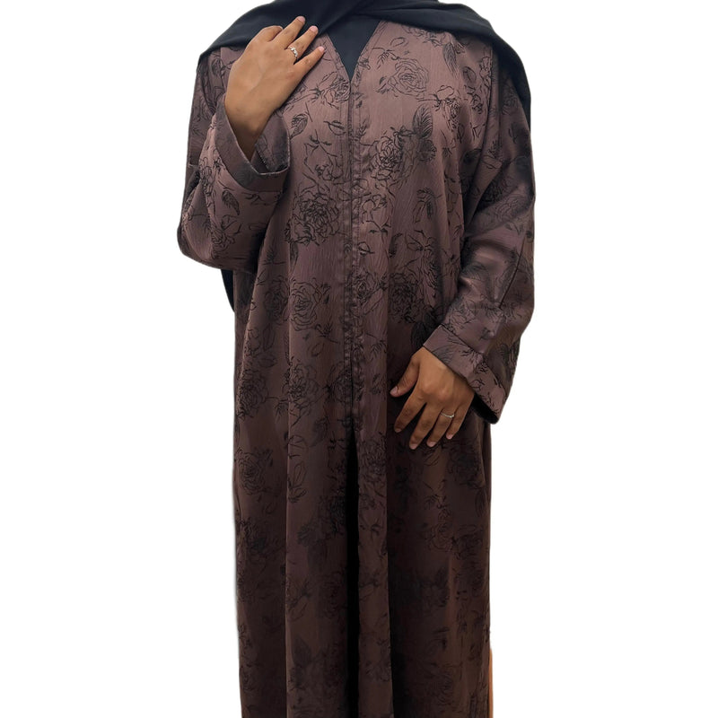 Brown floral embroidered abaya, angled front view showing the patterned sleeves.