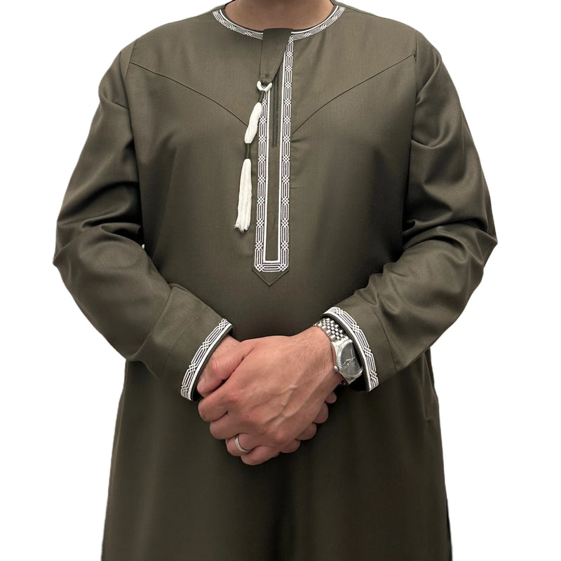 Green Embroidered Omani Thobe, front view showing pale embroidery and tassel.