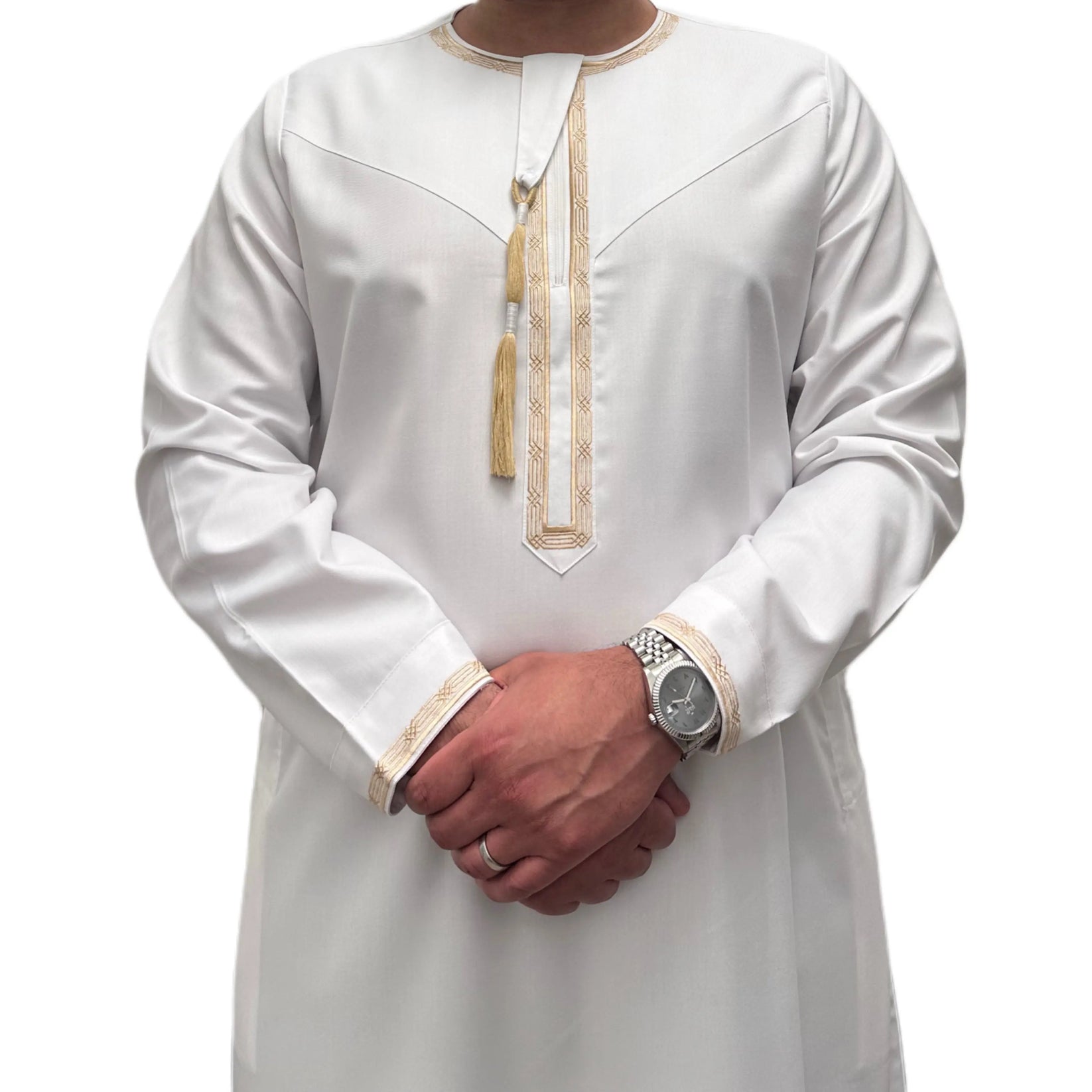 White Omani thobe featuring intricate embroidery on the collar and cuffs, with a traditional tassel hanging from the neckline. Made from premium fabric, showcasing elegant and refined craftsmanship.